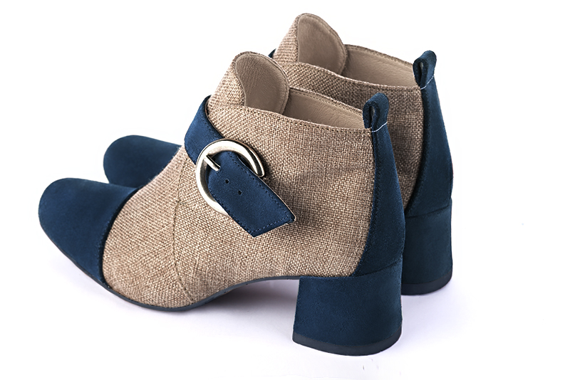 Navy blue and tan beige women's ankle boots with buckles at the front. Round toe. Low flare heels. Rear view - Florence KOOIJMAN